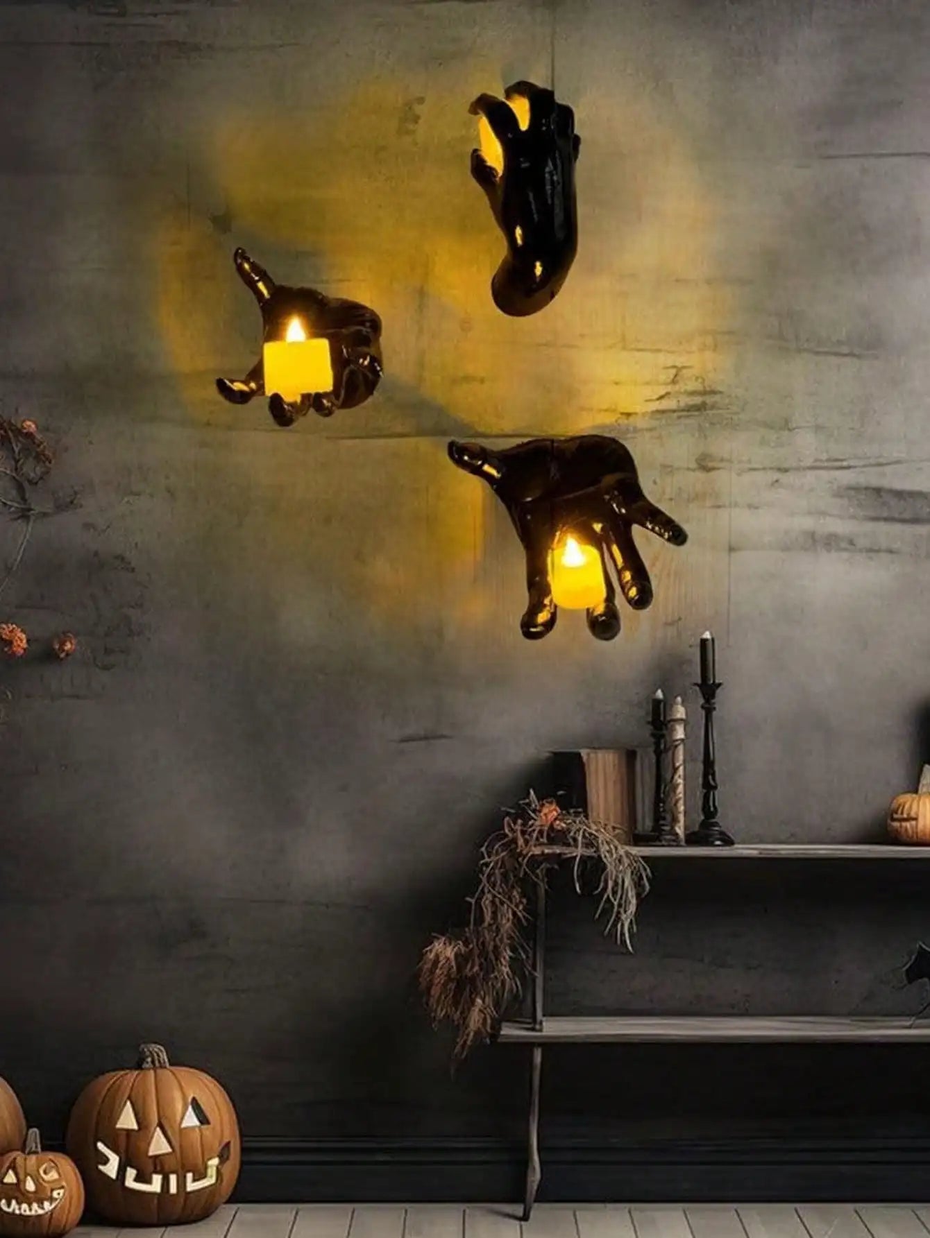 Wall mounted hands with candles