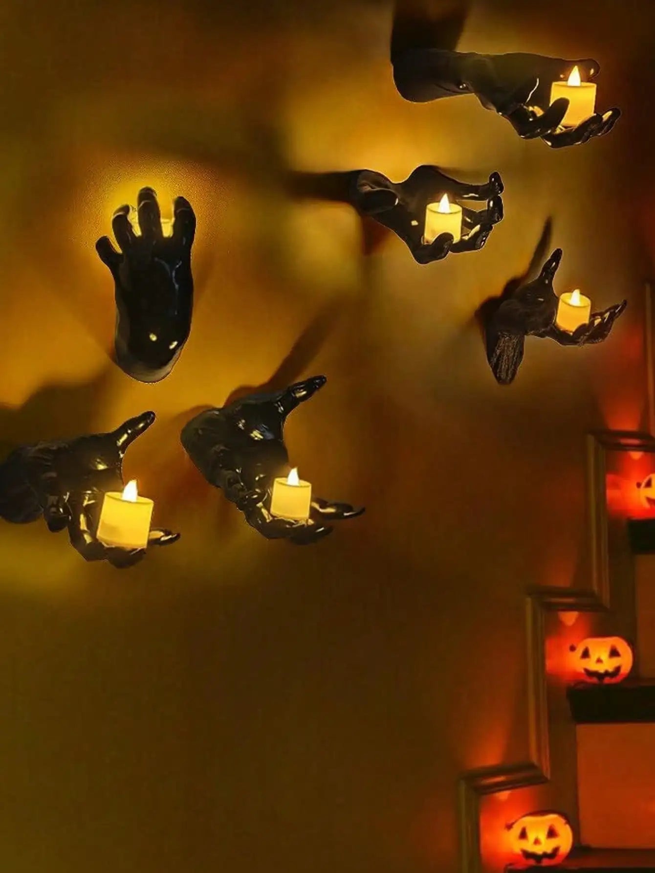 Wall mounted hands with candles
