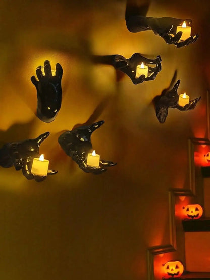 Wall mounted hands with candles
