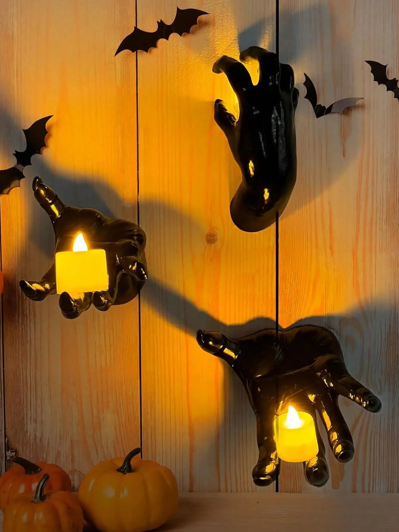 Wall mounted hands with candles
