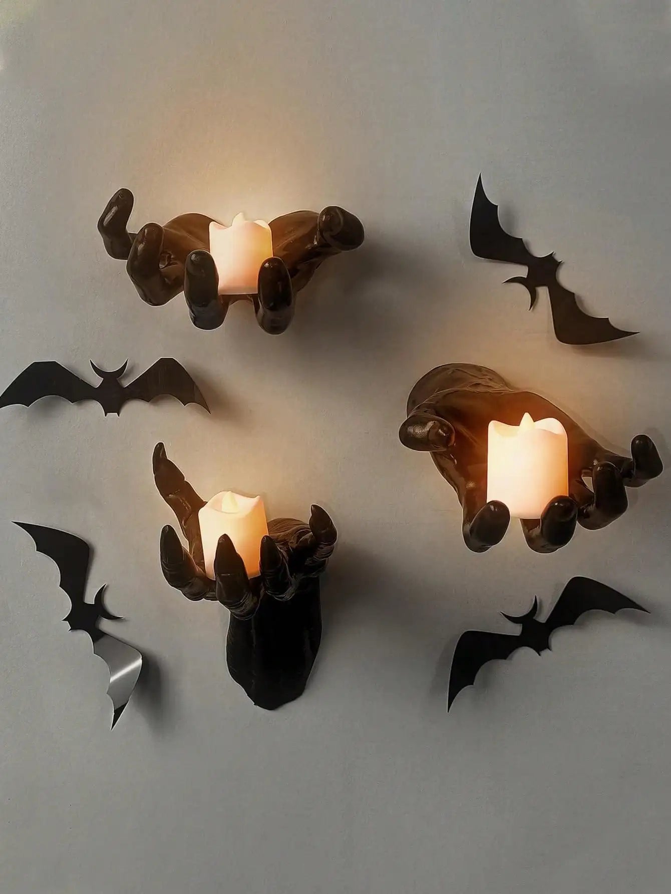 Wall mounted hands with candles